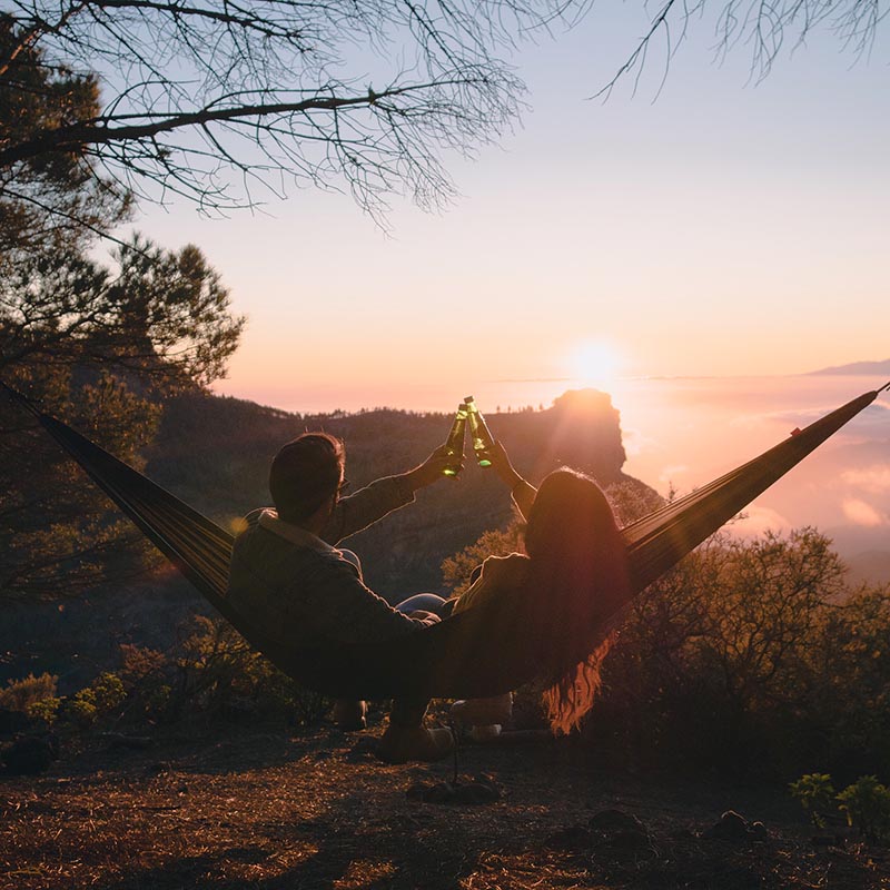 a-beautiful-couple-seated-in-a-hammock-toasting-wi-2021-04-04-08-36-29-utc-copy.jpg